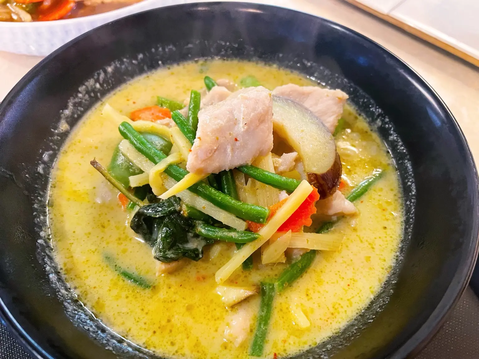 Thai green curry with chicken, bamboo shoots and fresh vegetables