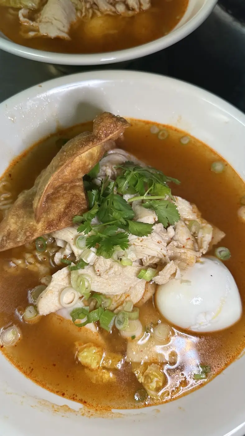 Spicy noodle soup with chicken and egg